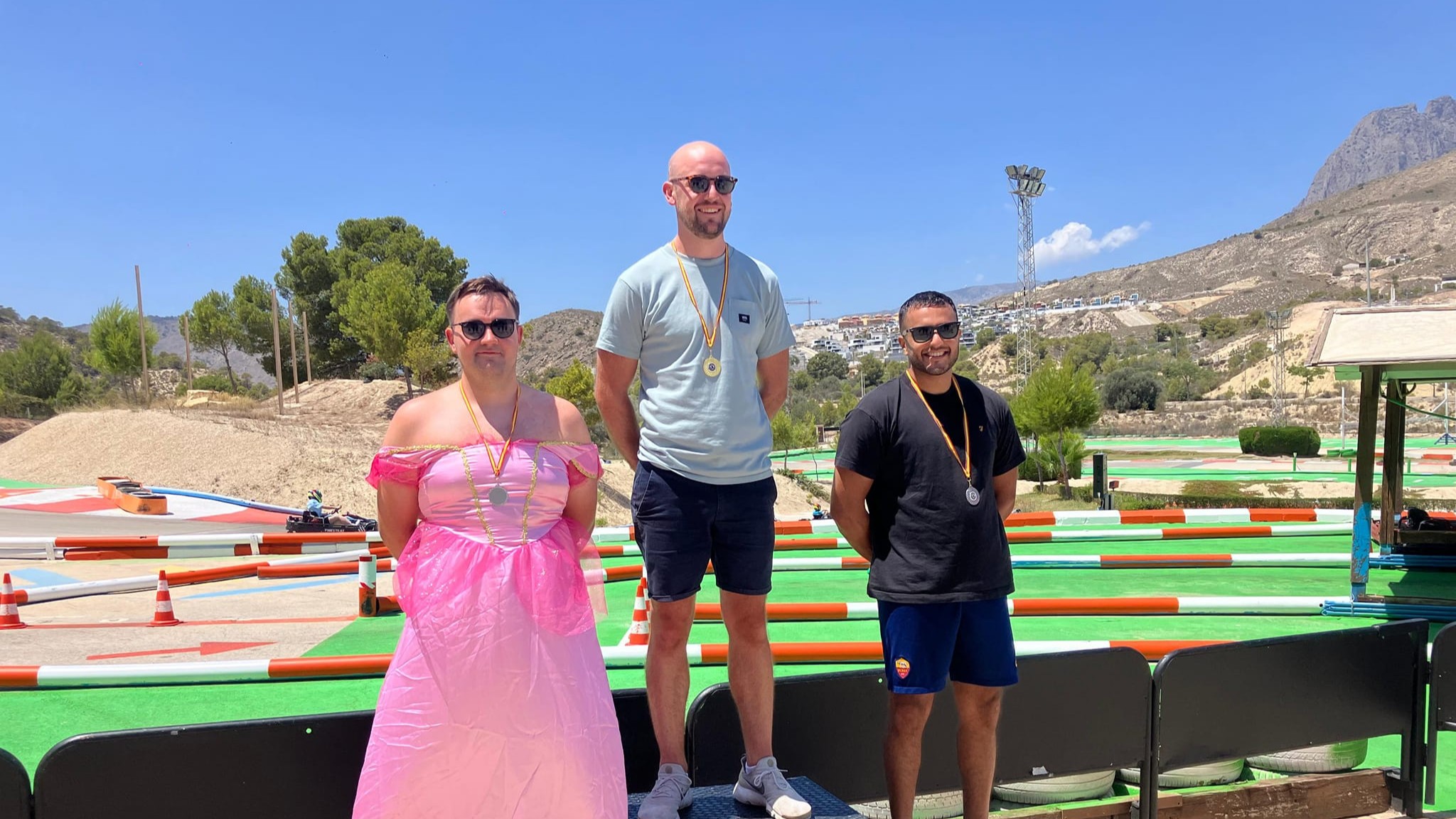 go-karting podium, stag dressed in pink 